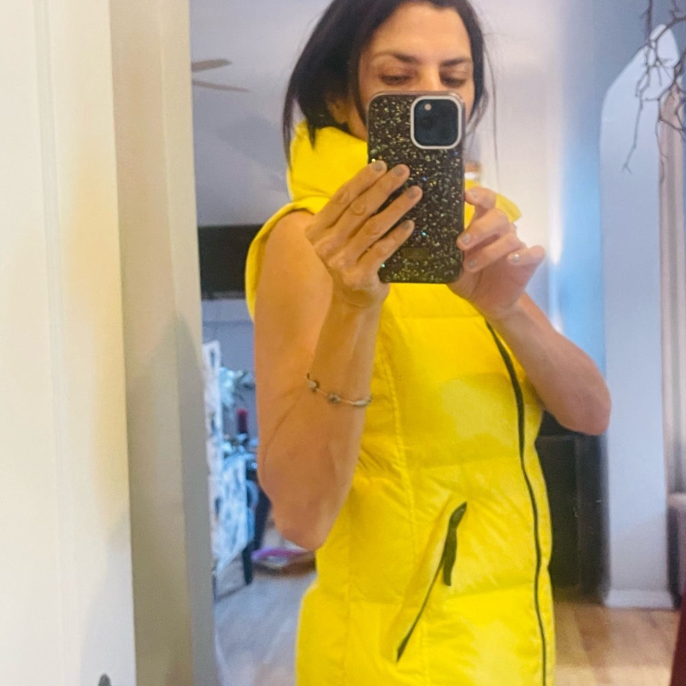 SAM, yellow puffer vest.